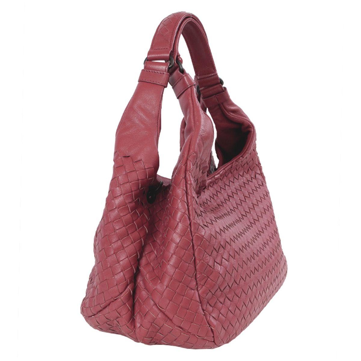 Bottega Veneta 'Medium Campana' shoulder bag in dusty pink leather. Closes with a hidden magnetic on top. Lined in suede with an open pocket against the frotn and a zipper pocket against the back. Has been carried and is in virtually new condition.