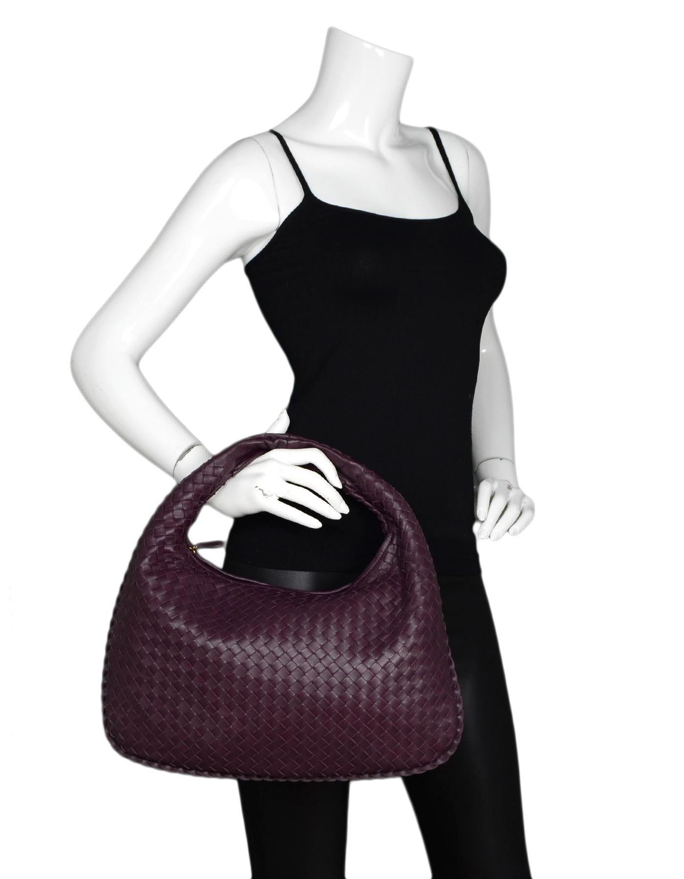 Bottega Veneta Eggplant Purple Woven Nappa Intrecciato Medium Veneta Hobo Bag

Made In: Italy
Color: Eggplant purple
Hardware: Goldtone
Materials: Nappa leather
Lining: Purple suede lining 
Closure/Opening: Zip top
Exterior Pockets: None
Interior