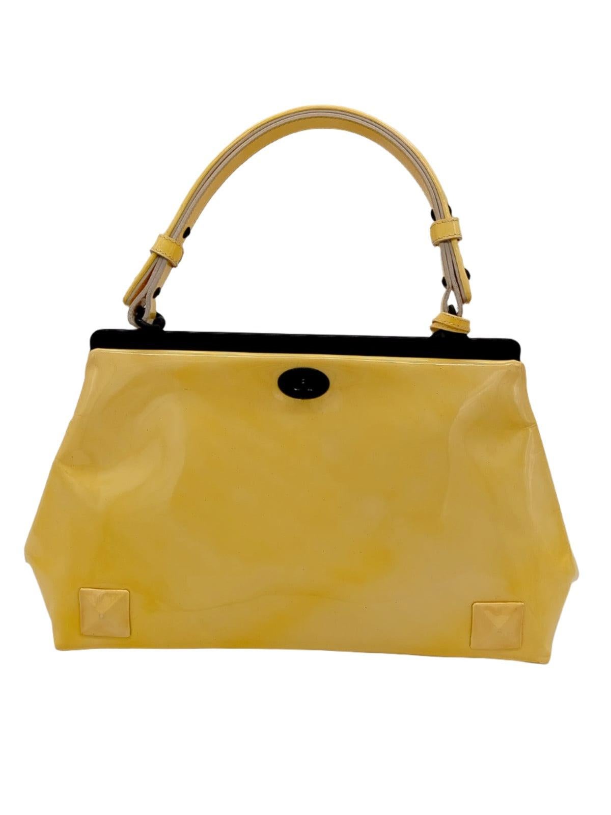 Bottega Veneta yellow patent leather tote bag. Featuring woven handles, bottom corner pyramid rivets and glossy black hardware.

Height:10;Width:30;Depth:15;Handle Drop:13 Material: Leather