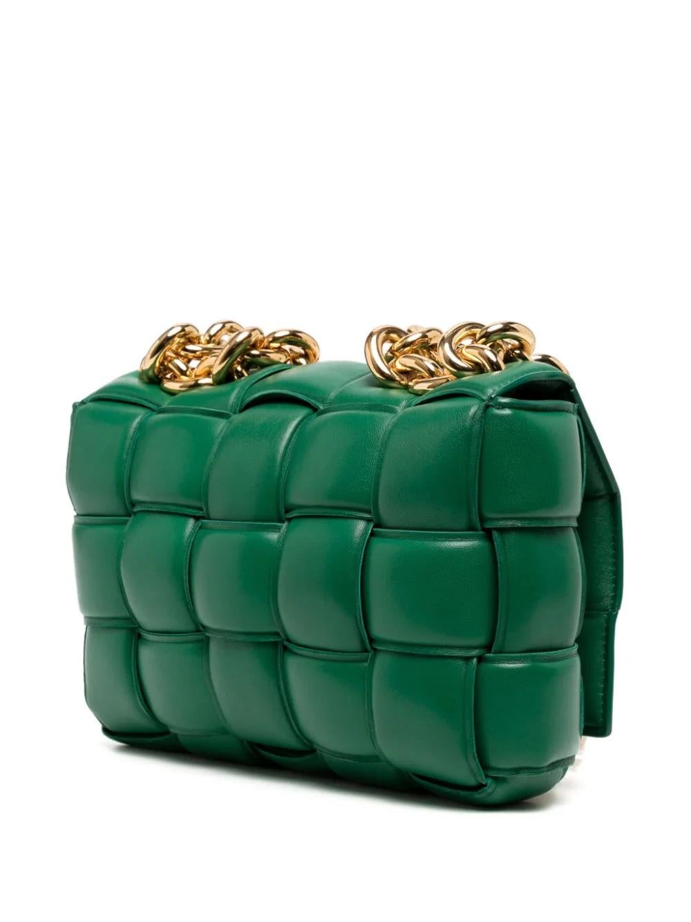 * Emerald green
* Leather
* Signature Maxi Intrecciato design
* Single chain-link top handle
* Chain-link shoulder strap
* Fold-over top
* Gold-tone hardware
* Excellent Condition: No major signs of wear. Comes with a dustbag.

Please note that most