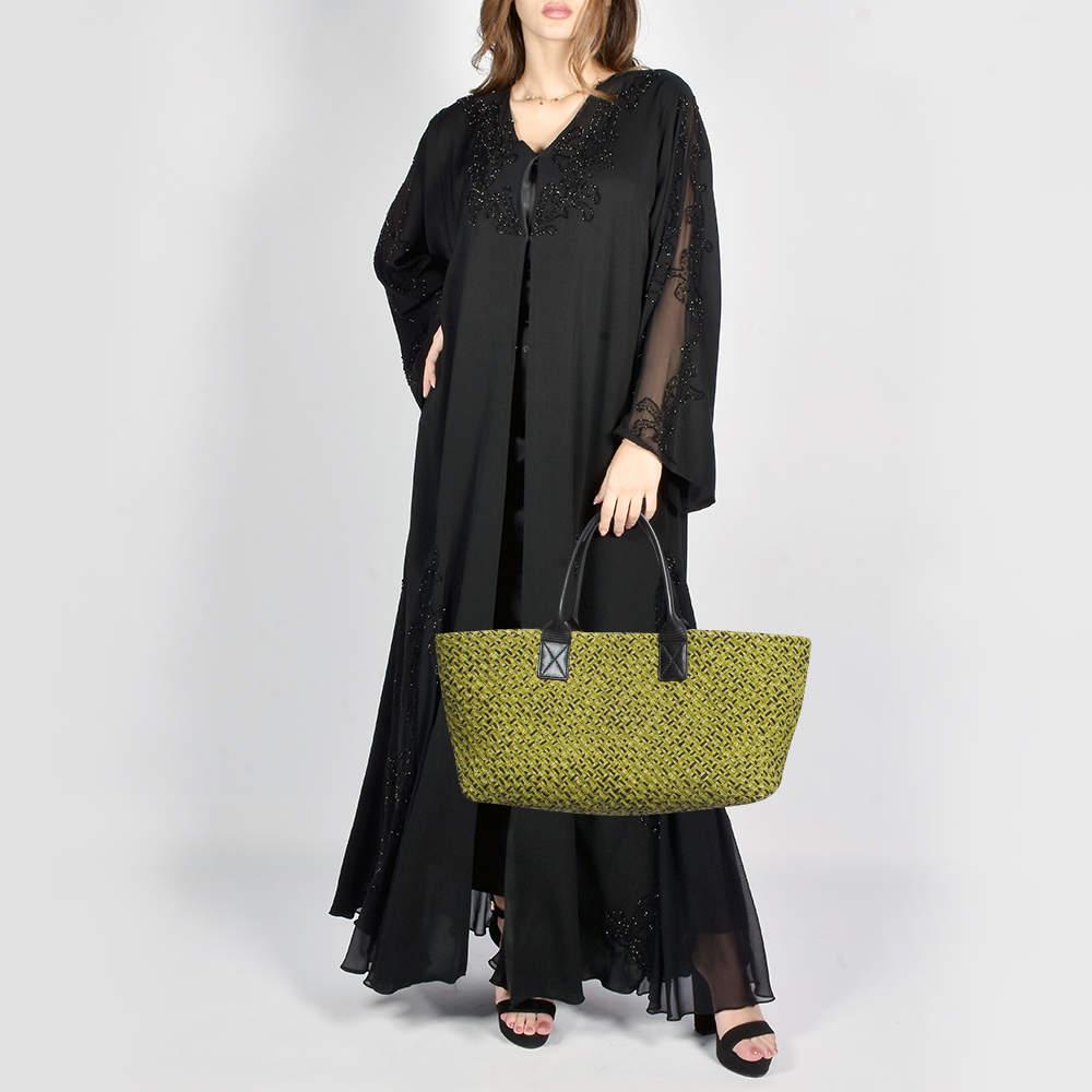 This Bottega Veneta tote promises to take you through the day with ease whether youre at work or out and about in the city. From its design to its structure the bag promises appeal and durability. It has two handles and a spacious interior to hold