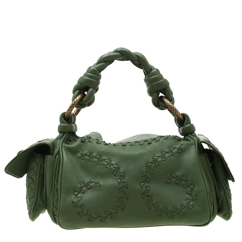 One look at this bag from Bottega Veneta and you'll be awed by its high style and magnificent appeal. It is crafted from green leather and accented with their signature Intrecciato trims flaunting a functional silhouette and sturdy construction.
