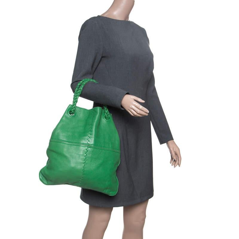 This Braided Handle hobo from Bottega Veneta is smart and stylish. Crafted from green leather the exterior of the bag flaunts a zip pocket. The suede lined spacious interior will hold all your belongings and more.

Includes: Original Dustbag