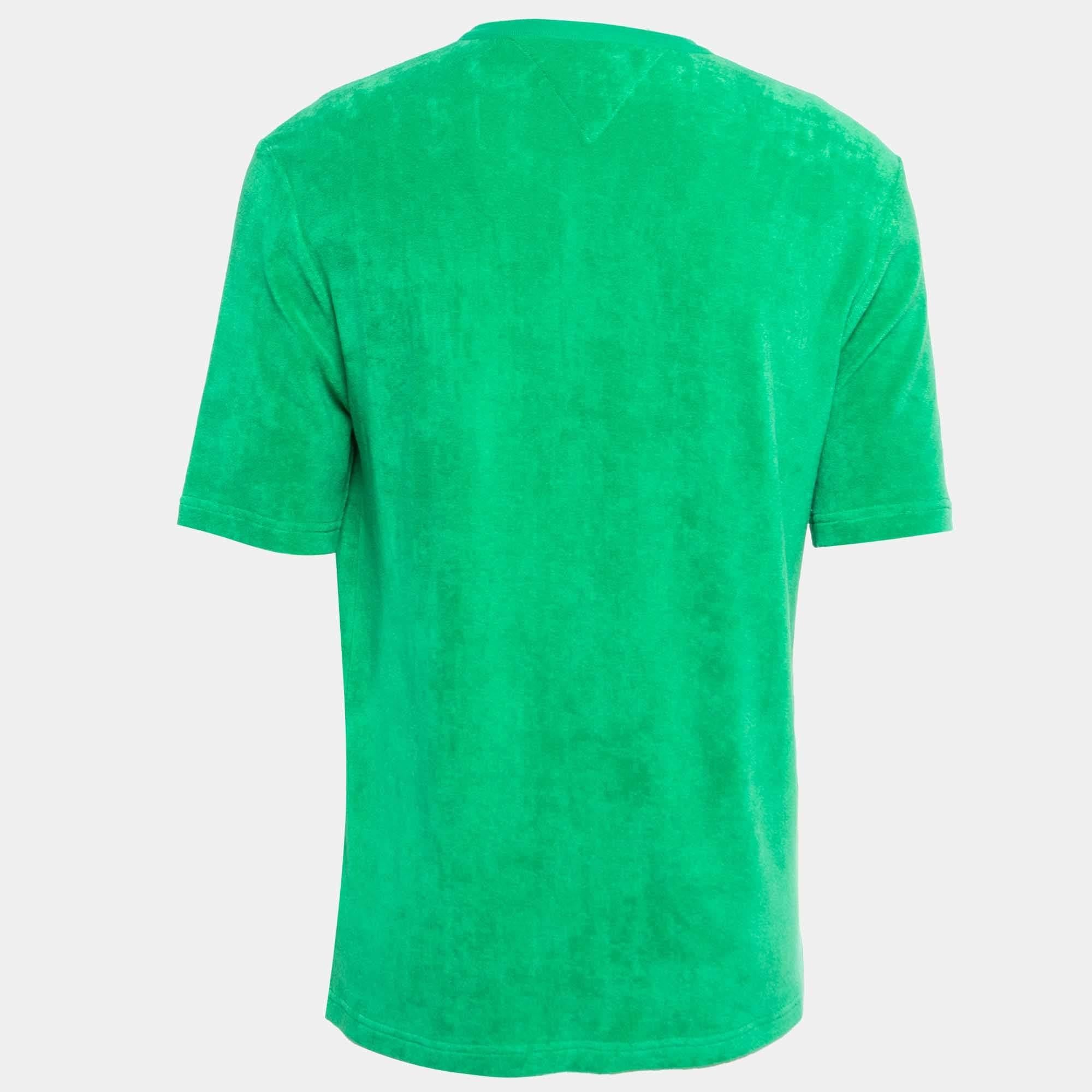 The Bottega Veneta t-shirt is a luxurious fashion staple. Crafted from soft terry cotton, it features a classic crew neck design in an elegant shade of green, offering both comfort and style. Perfect for casual or elevated occasions.

