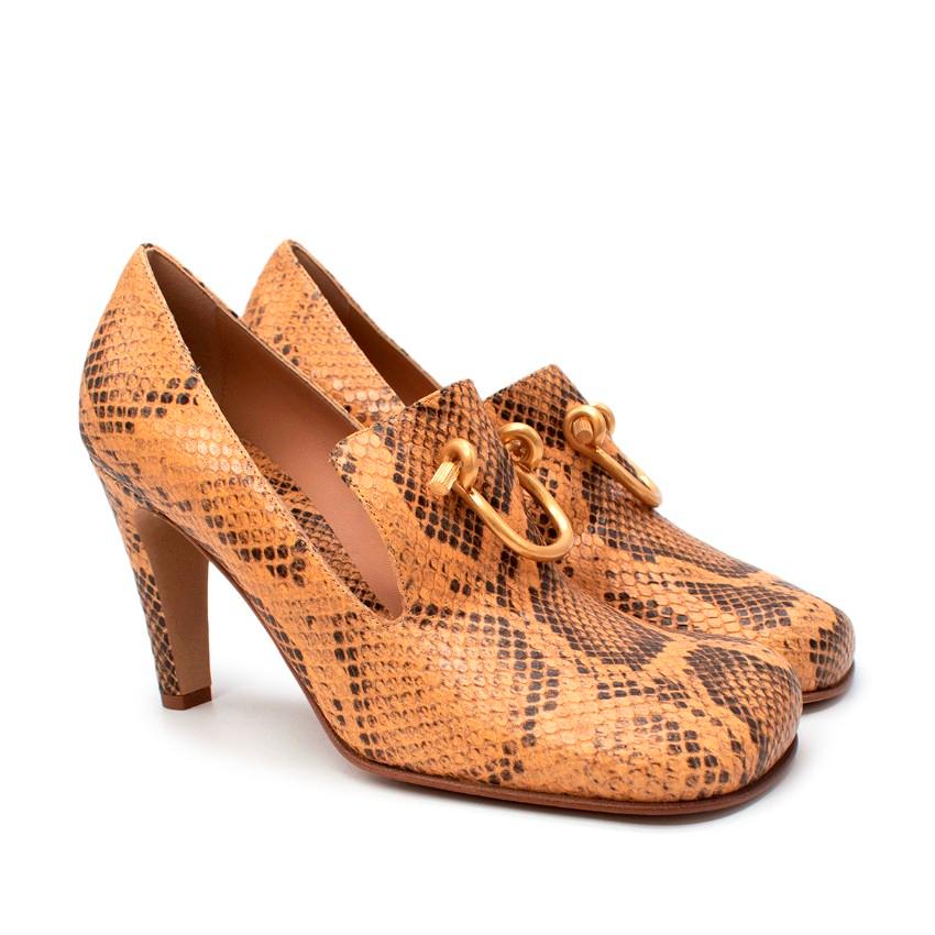 Bottega Veneta Honey Buckled Python-Effect Leather Pumps

- Tan-brown pumps sculpted to a modern interpretation of the 19th-century court shoe 
- Accented with a python print and texture
- Rounded square toe and a semi-fine heel
- Accented with an