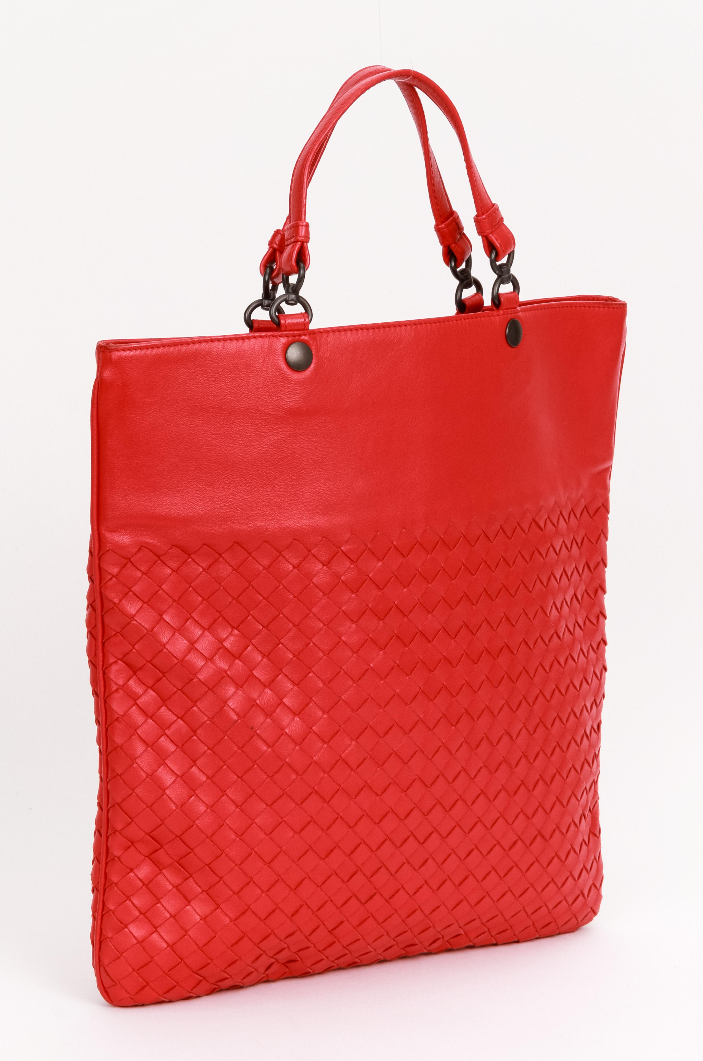 Bottega Veneta intrecciato red lambskin leather bag , dark metal hardware. Minor wear on corners , snap closure. Comes with original dust cover.