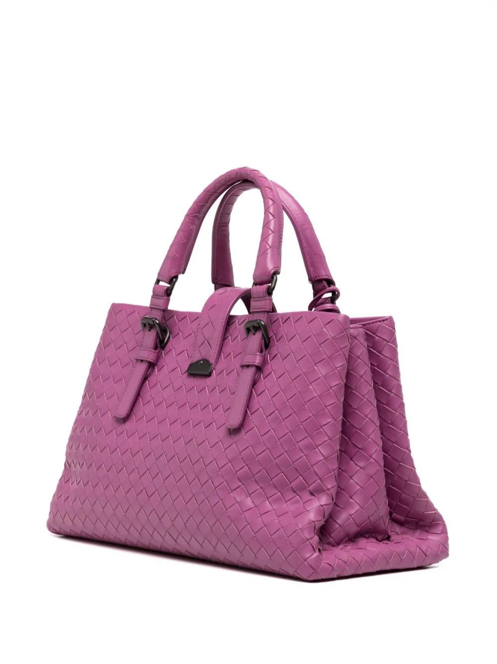 * magenta
* leather
* signature Intrecciato design
* leather tag
* strap closure and push-lock fastening
* two rolled top handles
* gunmetal-tone hardware
* rectangle body
* Excellent Condition: No major signs of wear.


Please note that most of the