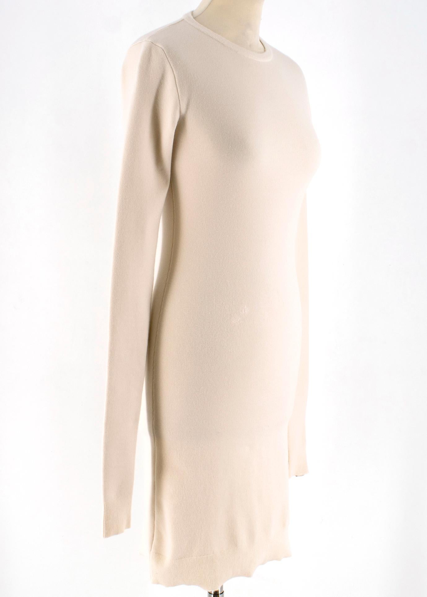 Body-skimming silhouette of this cream Bottega Veneta dress makes it a versatile piece that can be worn alone or used as a trans-seasonal building block. With ribbed edges and finished with a white Intrecciato leather tab at one cuff for a unique