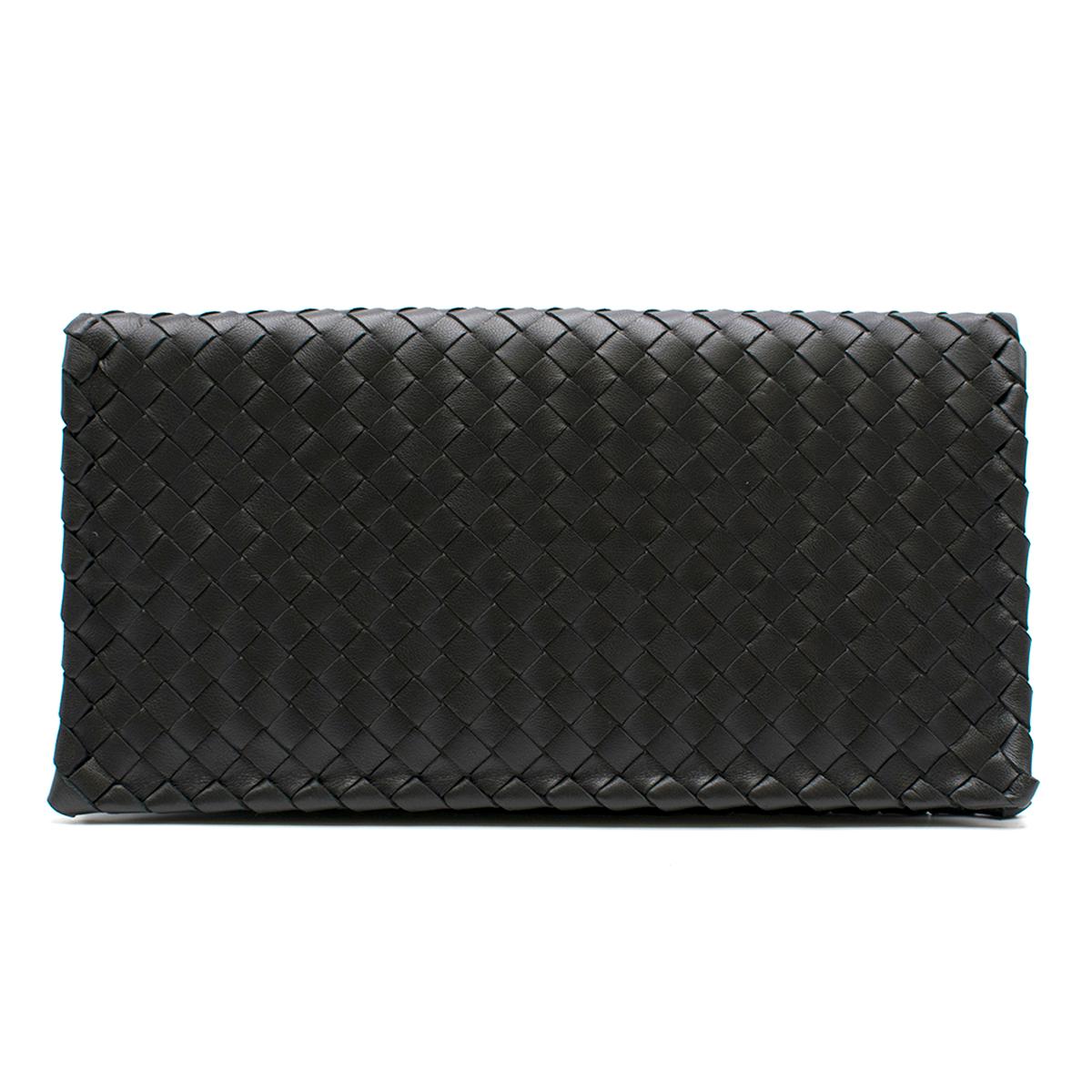 Bottega Veneta Intrecciato black leather clutch

- Black, Intrecciato woven leather 
- Intrecciato twist-lock fastening front flap
- Internal open compartment, one zip-fastening compartment
- Taupe-brown micro-fibre lining 

Please note, these items