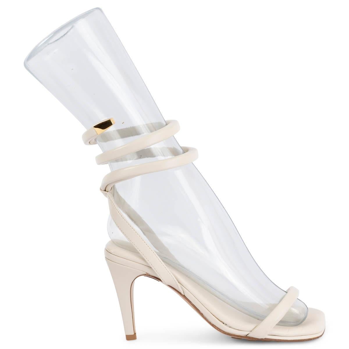 100% authentic Bottega Veneta Spiral sandals in ivory leather. Featuring a slingback with coiled ankle strap and gold-tone metal tip and a single strap over the toes. Rubber-injected leather soles for comfort and stability. Have been worn and show