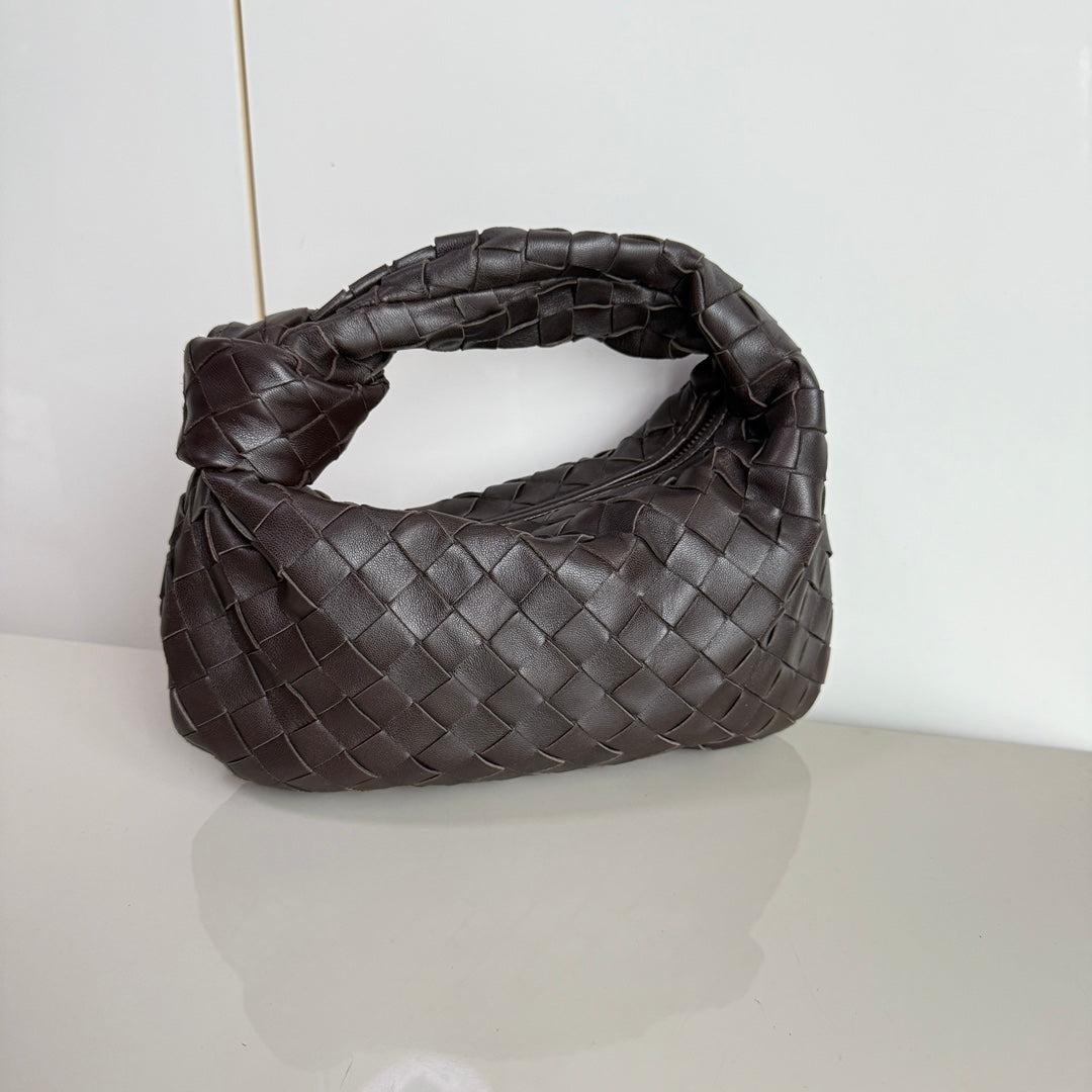 Bottega Veneta Jodie Mini Fondant Dark Chocolate Brown Lambskin Leather Clutch Bag
 These are professional photos of the actual bag.
 The Bottega Veneta Jodie Mini in elegant burgundy Leather offers the perfect balance between practicality and