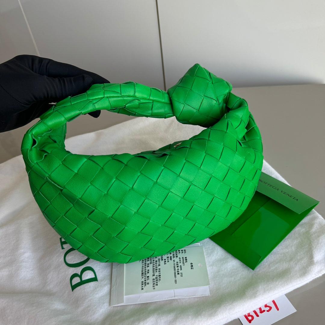 Bottega Veneta Jodie Mini Parakeet Green Lambskin Leather Clutch Bag Never Worn
 These are professional photos of the actual bag.
 The Bottega Veneta Jodie Mini in elegant burgundy Leather offers the perfect balance between practicality and luxury.