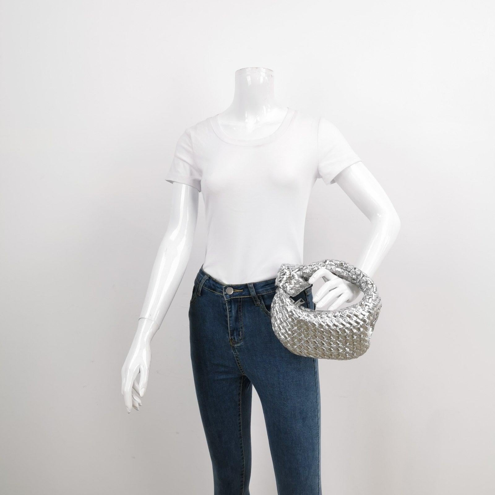 Bottega Veneta Jodie Mini Silver Leather Rare

The Bottega Veneta Jodie Mini in super rare silver Leather offers the perfect balance between practicality and luxury. Its mini size serves as a great everyday bag, while the iconic Intrecciato weave