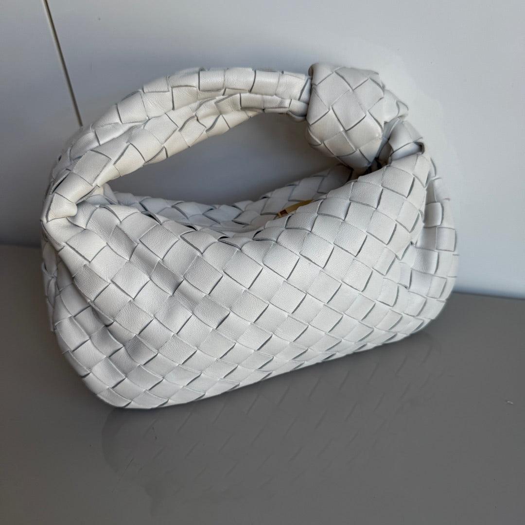 Bottega Veneta Jodie Mini White Leather Gold Hardware
 These are professional photos of the actual bag.
 The Bottega Veneta Jodie Mini in white Leather offers the perfect balance between practicality and luxury. Its mini size serves as a great