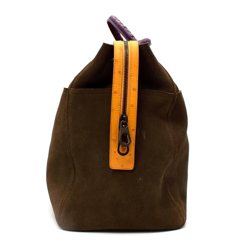 Bottega Veneta Khaki Suede Ostrich Trimmed Weekender
 

 - Deep olive green suede body with accents coming from yellow and purple ostrich skin trims
 - 2 rolled purple ostrich handles
 - Yellow ostrich trimmed agedsilver-tone metal zipper
 - Aged