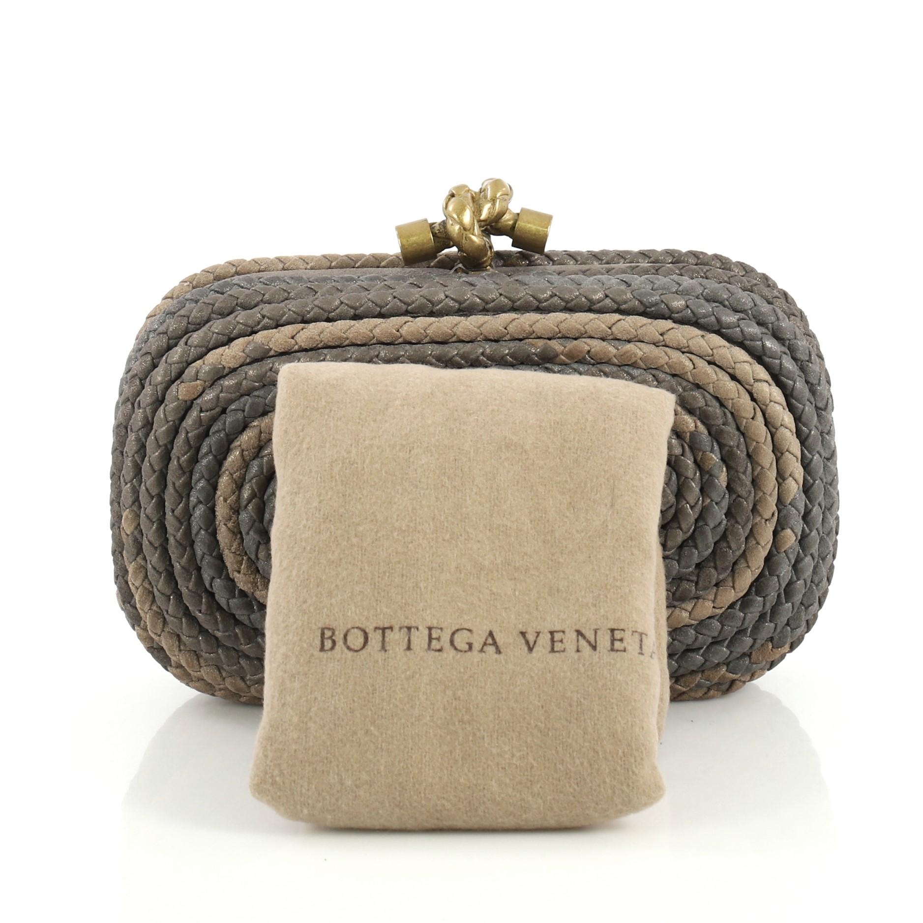 This Bottega Veneta Knot Clutch Braided Leather Small, crafted in metallic neutral braided leather, features aged gold-tone hardware. Its knot clasp closure opens to a metallic neutral suede interior.

Estimated Retail Price: $1,150
Condition: