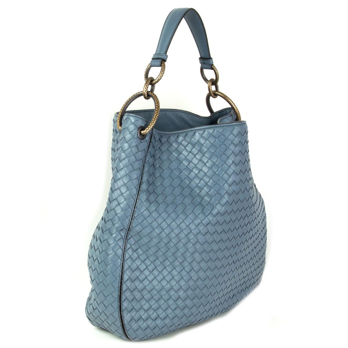 Bottega Veneta 'Medium Loop' shoulder bag in Krim (pale blue) Intrecciato featuring dark gold-tone metal hardware. Lined in taupe suede with one zipper pocket against the back and one open pocket against the front. Has been carried and is in