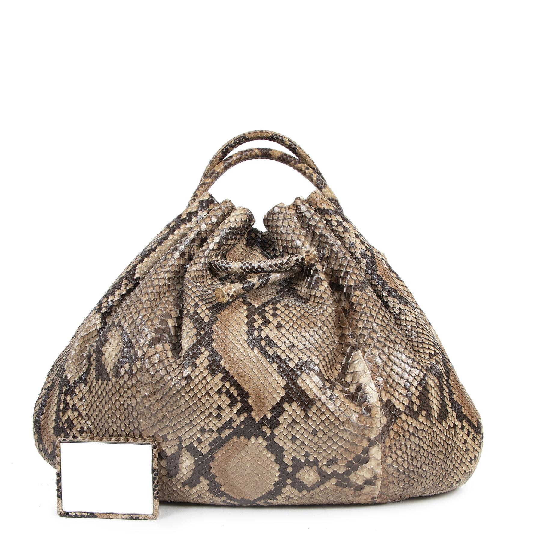 Very good condition

Bottega Veneta Large Python Hobo Bag

The hobo bag has returned from the past and is here to stay! This gorgeous Bottega Veneta bag is the perfect piece to join the trend and comes in a print that's just as stylish. The bag is