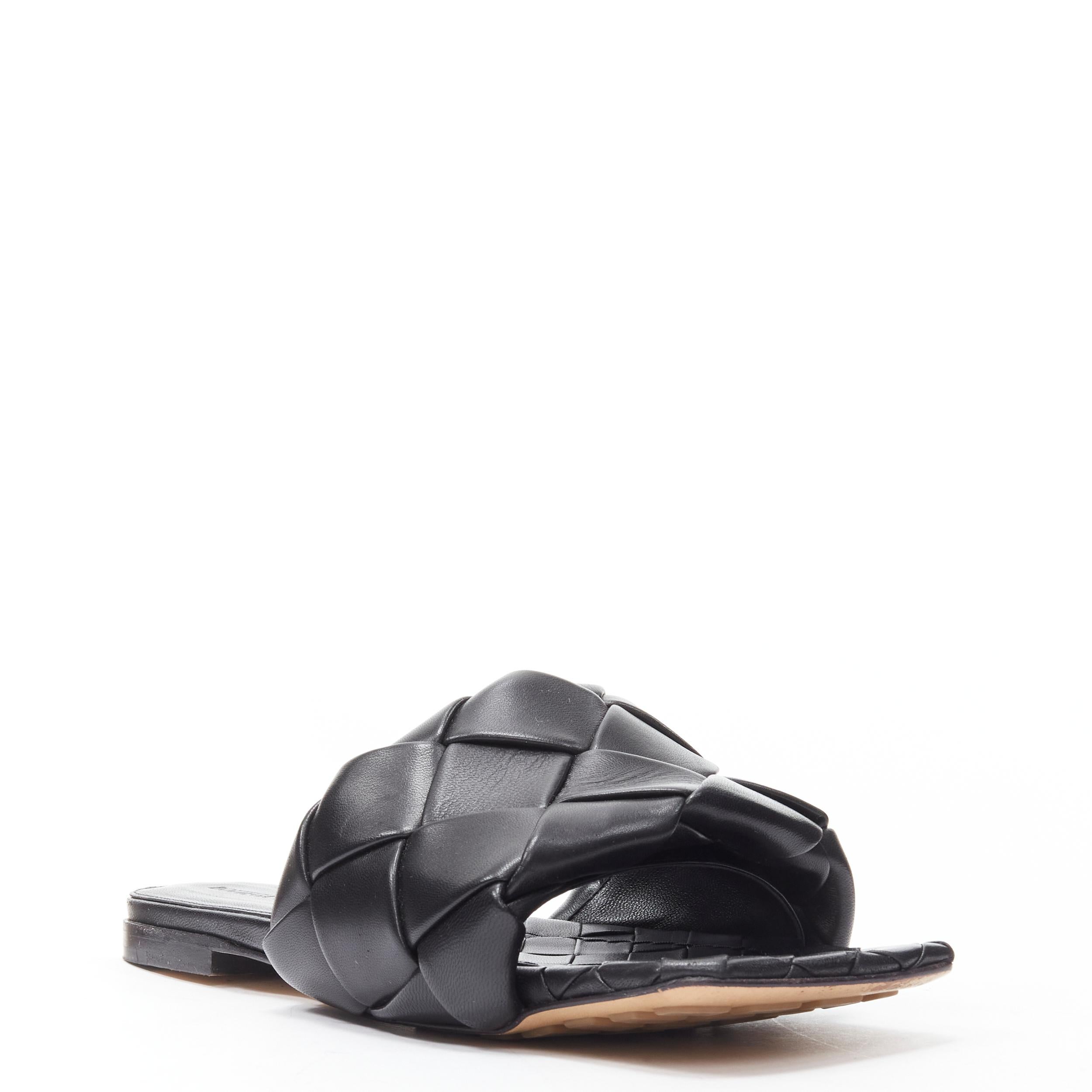 BOTTEGA VENETA Lido black padded Intrecciato woven square toe slides EU38.5
Reference: MELK/A00205
Brand: Bottega Veneta
Model: Lido
Material: Leather
Color: Black
Pattern: Solid
Made in: Italy

CONDITION:
Condition: Excellent, this item was