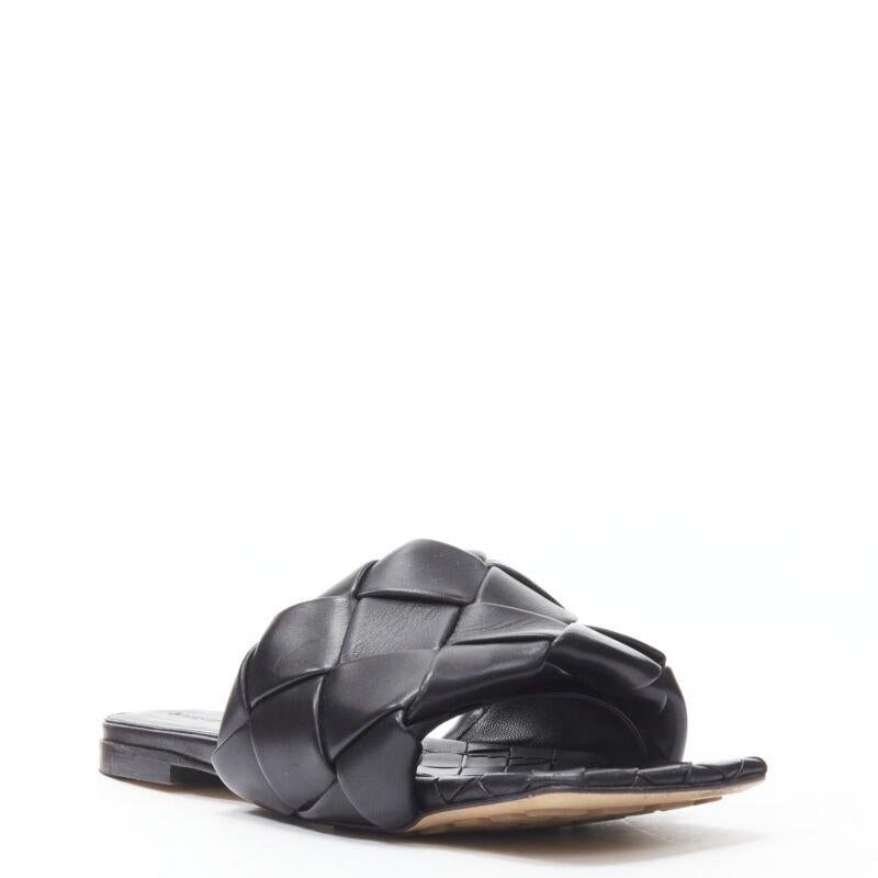 BOTTEGA VENETA Lido black padded Intrecciato woven square toe slides EU38.5
Reference: MELK/A00205
Brand: Bottega Veneta
Designer: Daniel Lee
Model: Lido
Material: Leather
Color: Black
Pattern: Solid
Lining:  Leather
Made in: