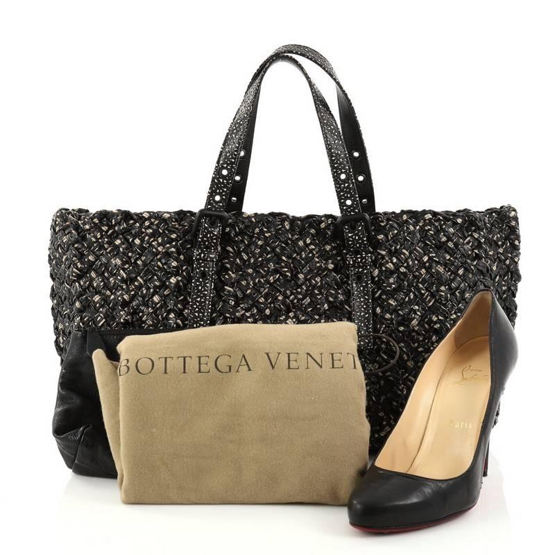 This authentic Bottega Veneta Lido Tote Limited Edition Tourmaline Nappa Nastri Leather Medium is an intricate twist from the classic tote ideal for everyday use. Crafted in black and white nappa nastri leathe in unique intrecciato method, this bag