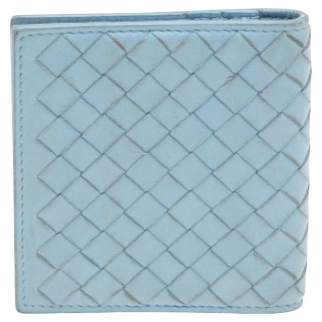 Store your important valuables safely in this wallet from the House of Bottega Veneta. Made from light-blue Intrecciato leather, this wallet features black-tone hardware and a leather-lined interior. This cute and handy wallet will definitely prove