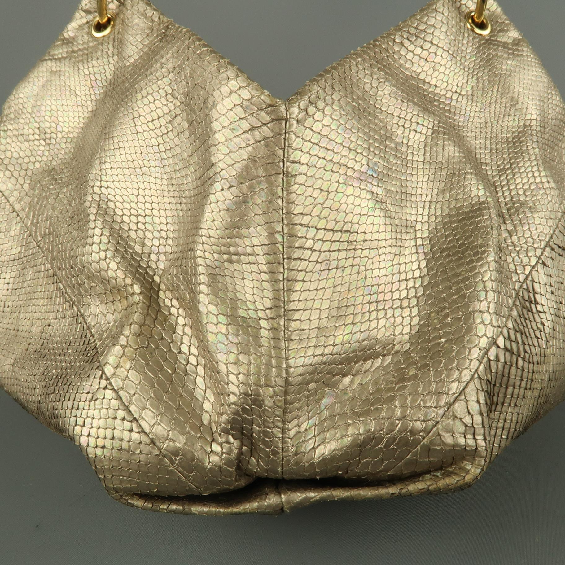 Vintage BOTTEGA VENETA hobo bag comes in metallic light gold iridescent snake skin with a unique structured diamond shape, rolled top handle with gold tone loop hardware, and green suede dual compartment interior with zip divider and mirror. Made in