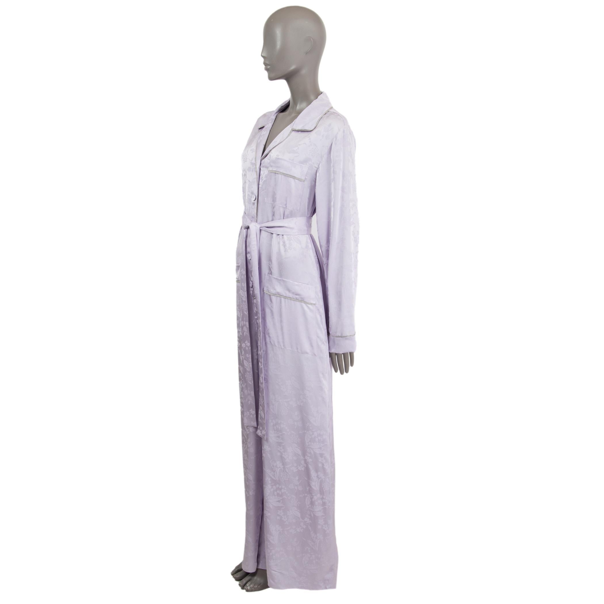 100% authentic Bottega Veneta fluid silk-blend floral jacquard jumpsuit in lilac viscose (68%) and silk (32%) edged with silver grey silk piping. Classic pyjama-style collar and covered buttons fastening. Comes with a removable self-tie belt, single