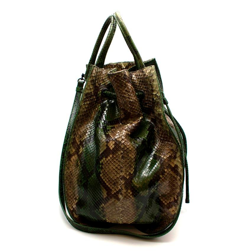 Bottega Veneta Limited Edition Green python XL hobo

- Large hobo bag
- Short handle and detachable long strap
- Draw string fastening
- Matching snake skin mirror
- Soft suede lining with inner pocket

Limited edition bag. Only 100 made, this is 