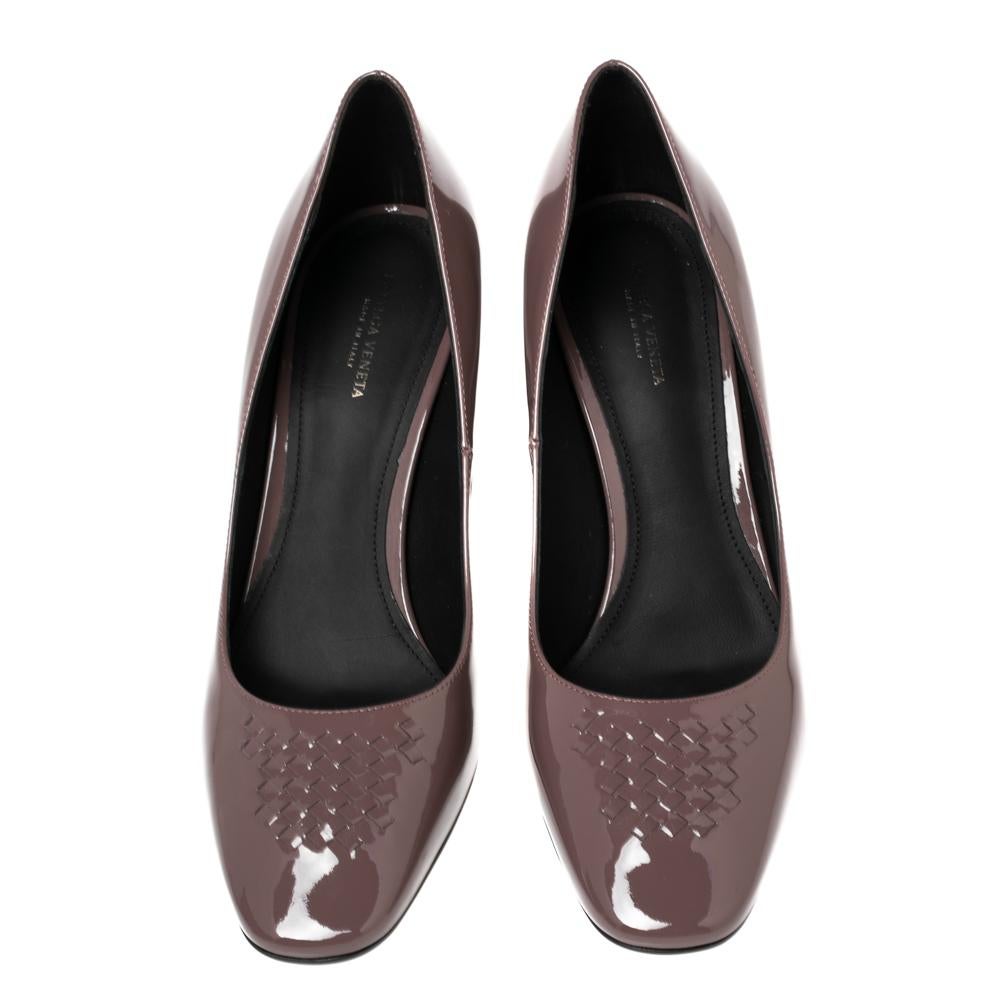 Bottega Veneta elevates a simple pair of pumps using its signature of a minimal yet timeless design approach. Made from patent leather, the BV pumps are graced with the iconic intrecciato motif on the uppers and lifted by block heels.

Includes:
