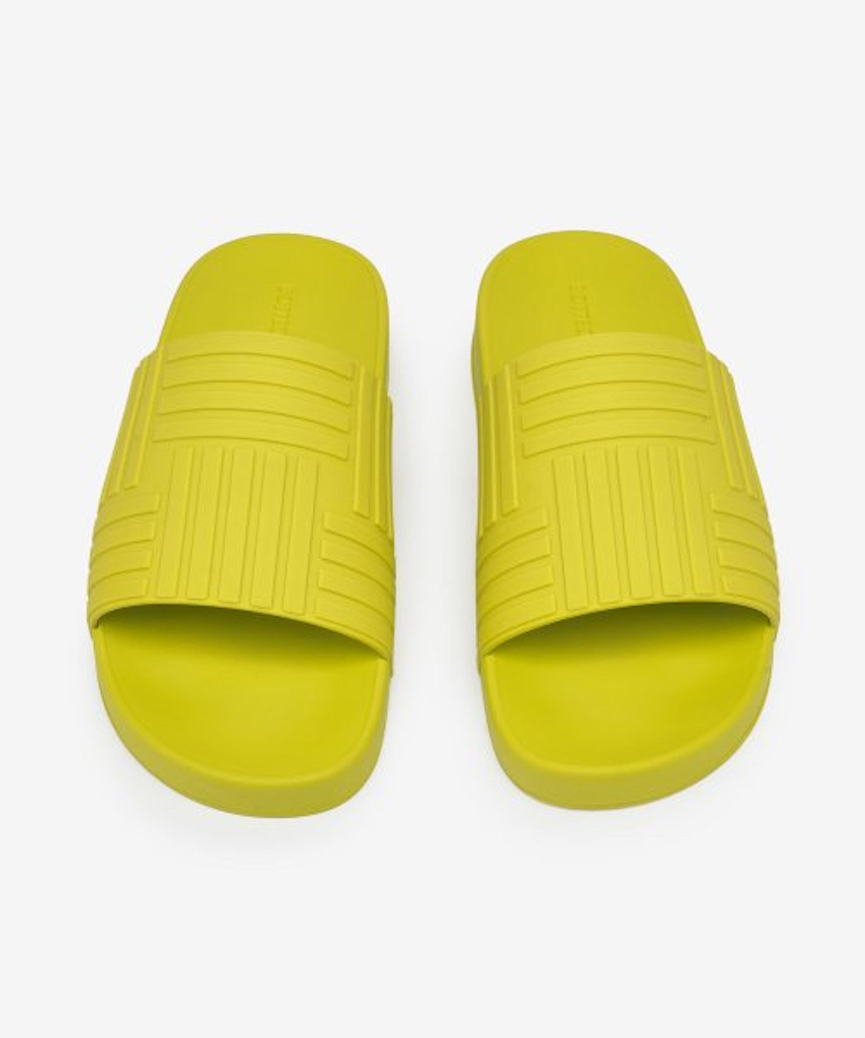 Rubber slip-on sandals in Kiwi green. Graphic pattern embossed at vamp. Logo-embossed molded rubber footbed. Treaded rubber sole. Made in Italy.
Brand new, never worn, comes in all original packaging.