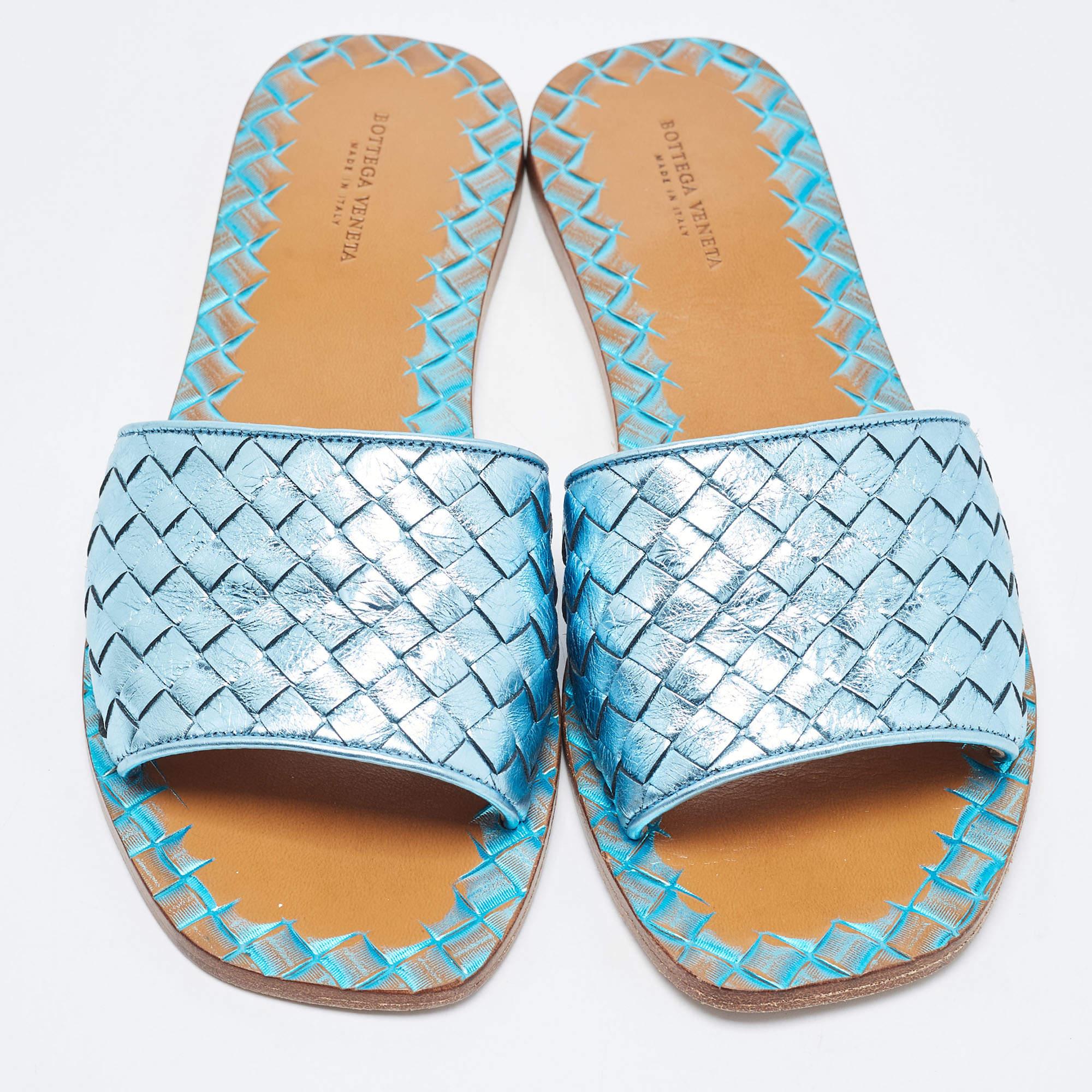 These well-crafted Bottega Veneta flat slides have got you covered for all-day plans. They come in a classy metallic blue design, and they look great on the feet.

Includes: Original Box

