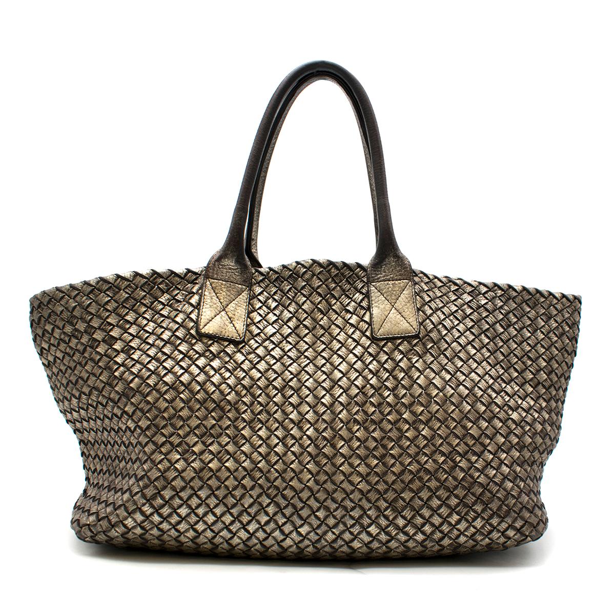 Bottega Veneta Metallic Limited Edition Cabat Pewter Calf Tote

- Pewter, heavy-weight woven leather tote bag
- Interior features a zip pocket and a flat pocket
- This item features an exclusive seamless construction, that allows the soft sides to