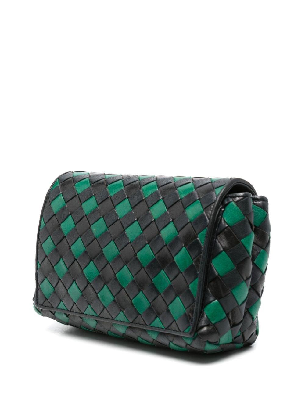Bottega Veneta Intrecciato black & green mini bag featuring iconic Intrecciato design, front snap button closure featuring tassel detailing, thin shoulder/crossbody strap, beige suede lining with two inner compartments and inner zipper pocket,