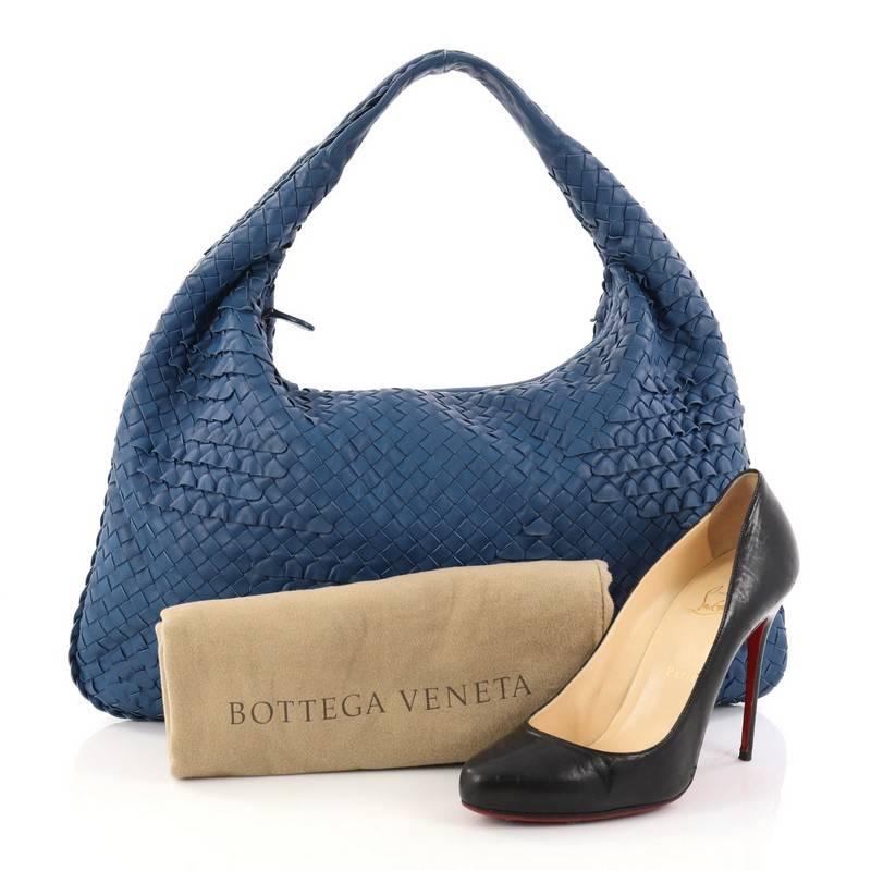 This authentic Bottega Veneta Miniode Hobo Intrecciato Nappa Large is a perfect bag to add to your collection. Crafted in Bottega's signature Intrecciato woven blue leather with frilly ruffled detailing, this chic bag features a looping shoulder