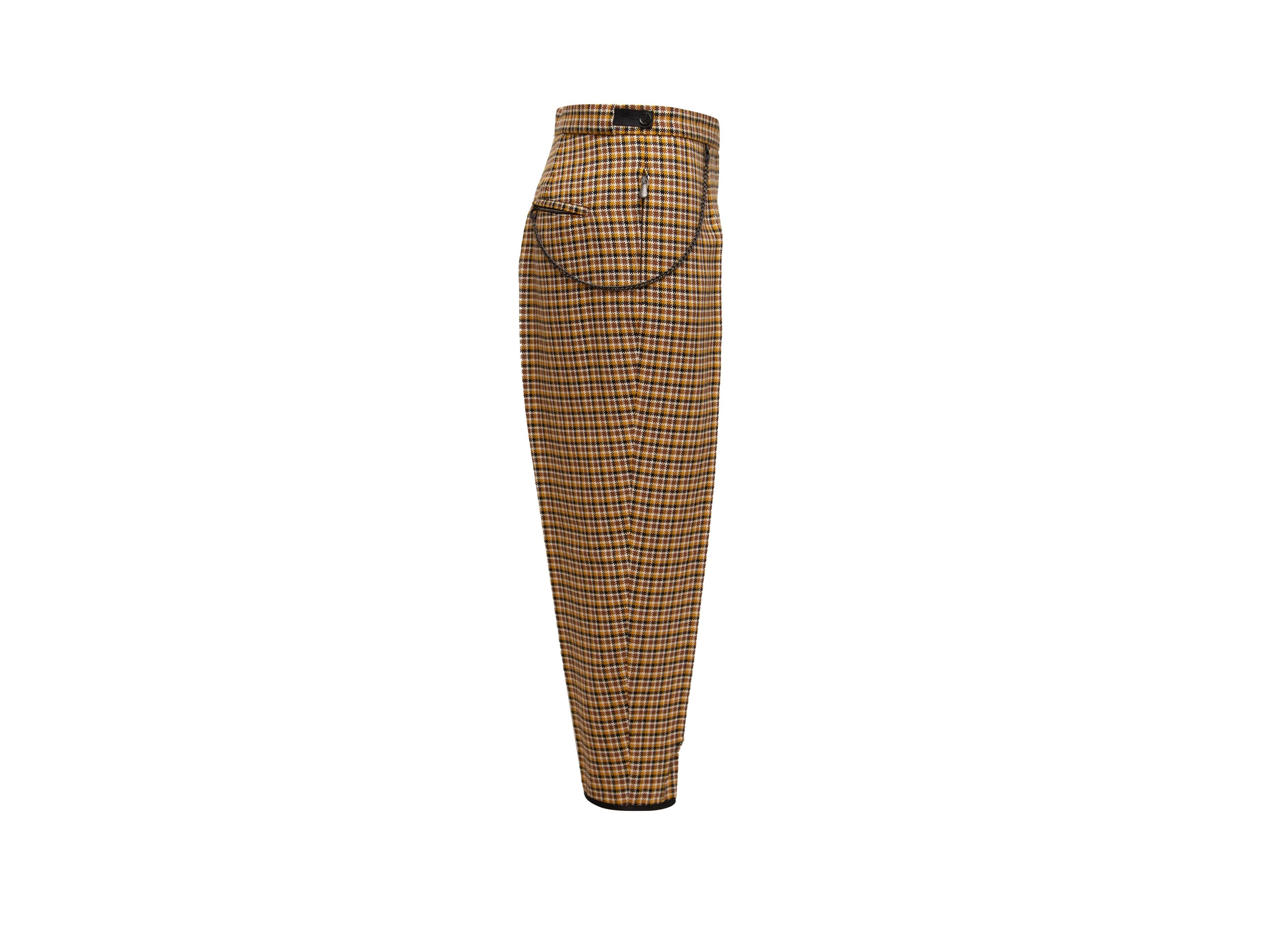 Product details: Mustard and multicolor wool plaid trousers by Bottega Veneta. Single back pocket. Chain adornments at sides. Designer size 46. 37
