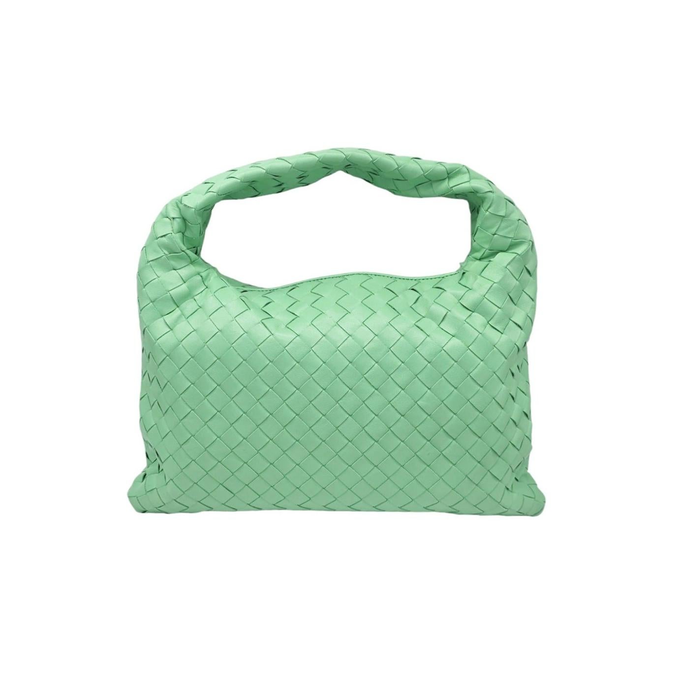 Indulge in luxury with the Bottega Veneta Nappa Intrecciato Small Hop Hobo Bag. Crafted in Italy from smooth Nappa leather, this hobo bag features an intricate woven design in a stunning light green color. The incorporated looping shoulder strap and
