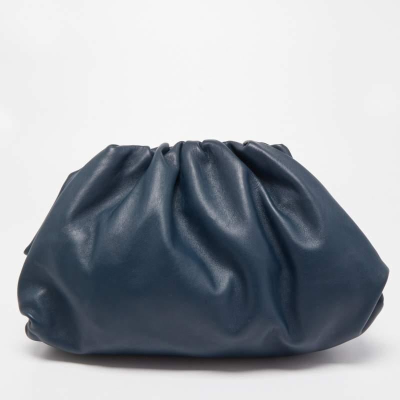 A bag that took the fashion world by storm, Bottega Veneta’s The Pouch clutch reflects Daniel Lee’s distinctive style choices. This version is skillfully made from navy blue leather into an unstructured silhouette, providing ample space. Get ready