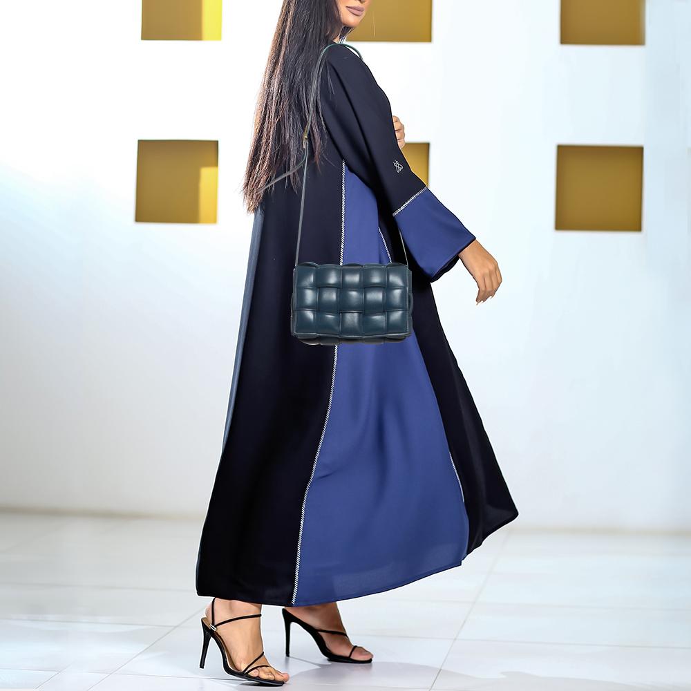 The current bag on many fashionistas' minds is this Cassette bag from the house of Bottega Veneta. We have here the one in navy blue leather, flaunting a padded maxi weave and a shoulder strap. The insides are sized to fit your essentials that you