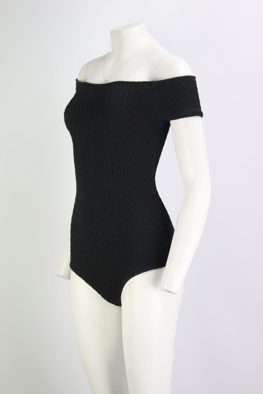 Bottega Veneta off the shoulder seersucker swimsuit. Made from black seersucker, it has a flattering off-the-shoulder silhouette. Black. Pull on. 98% Polyamide, 2% elastane. Size: IT 40 (UK 8, US 4, FR 36). Bust: 30 in. Waist: 23 in. Hips: 33 in.