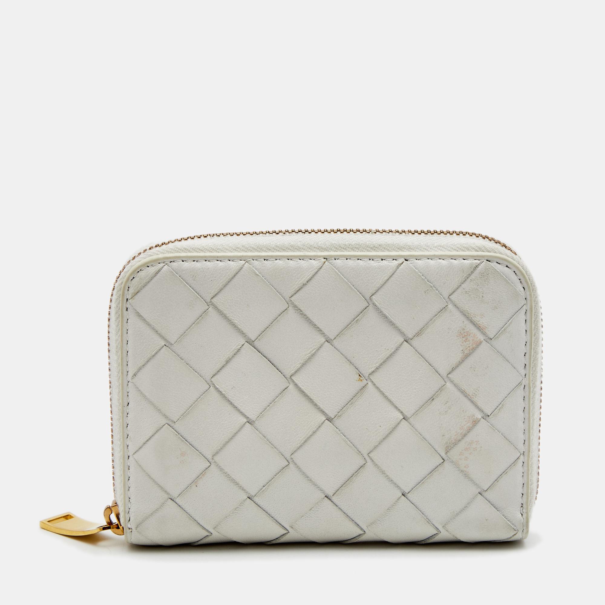 Bottega Veneta's leather coin purse is finished with the label's signature intrecciato weave – a heritage detail that brings an artisanal flourish to the simple composition. It's crafted in Italy with internal compartments lined with leather and