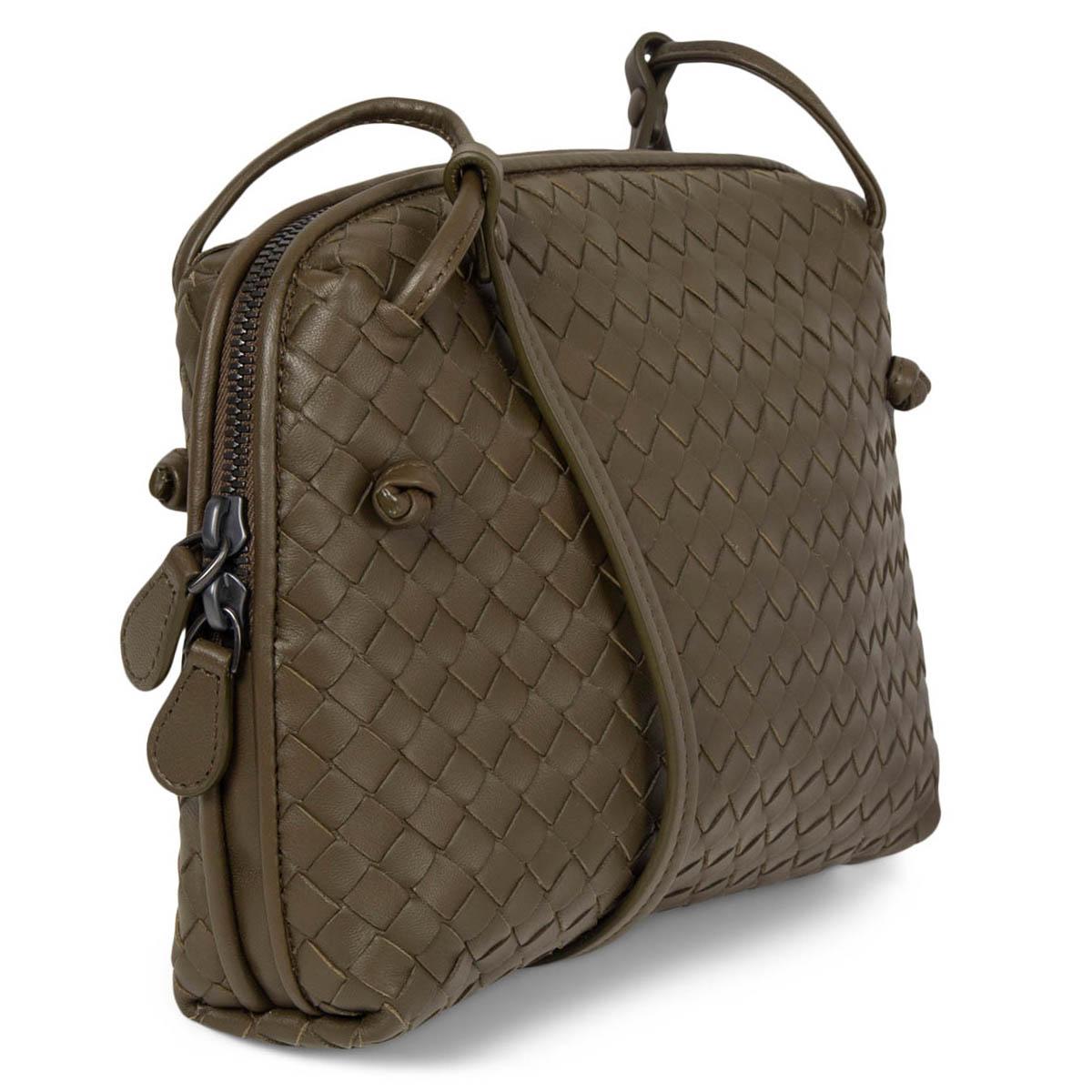 100% authentic Bottega Veneta Nodini Small crossbody bag in olive green Intrecciato lambskin. Opens with a double zipper on top and is lined in dark taupe suede with one zipper pocket against the back and a slip pocket against the front. Brand new.