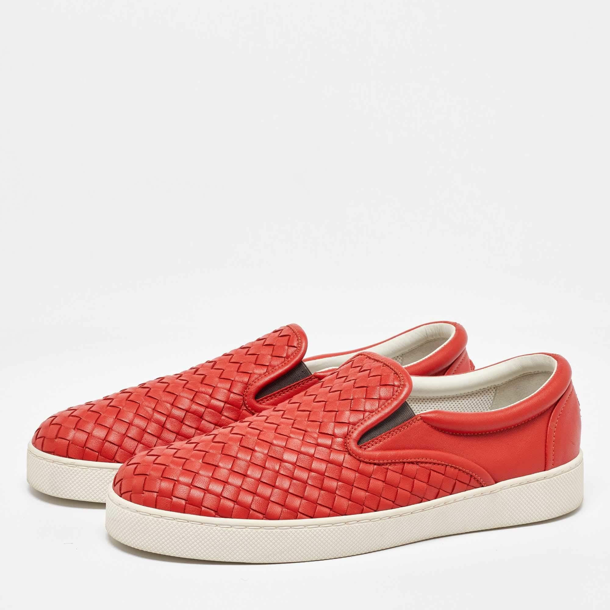 These sneakers from the House of Bottega Veneta are here to grant your feet the ultimate comfortable experience. They are crafted from orange Intrecciato leather and showcase a slip on style. Add these trendy sneakers to your collection and sport a