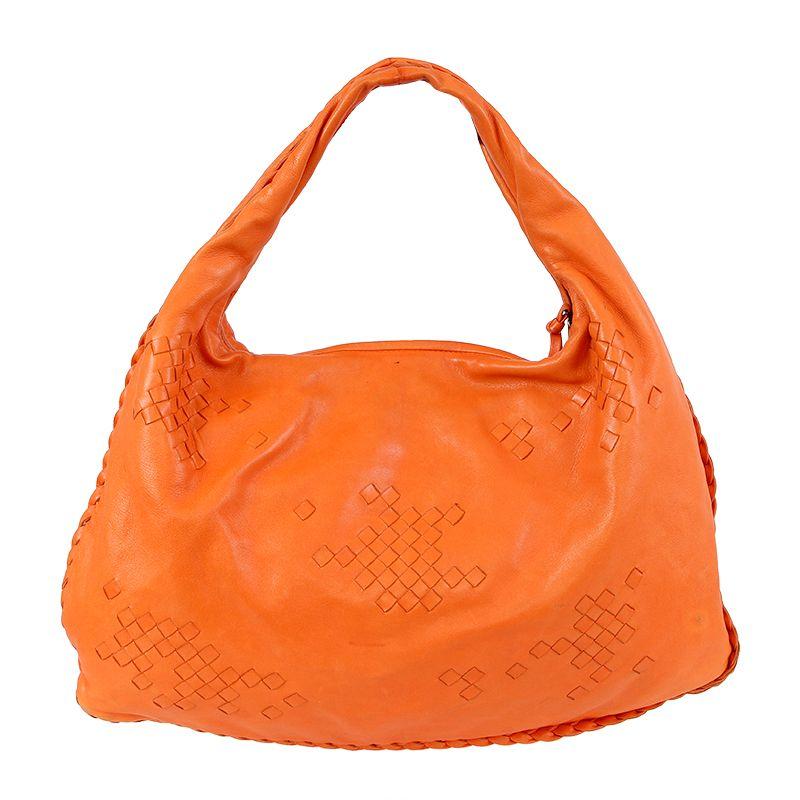 Bottega Veneta 'Large Veneta' shoulder bag in orange lambskin leather with patial waving. Opens with a zipper on top. Lined in beige suede with an open pocket against the front and a zipper pocket against the back. Has been carried with wear and