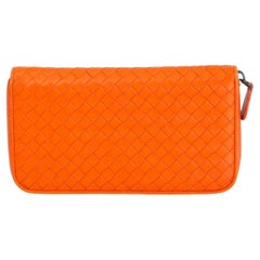 BOTTEGA VENETA orange leather INTRECCIATO ZIP AROUND CONTINENTAL Wallet