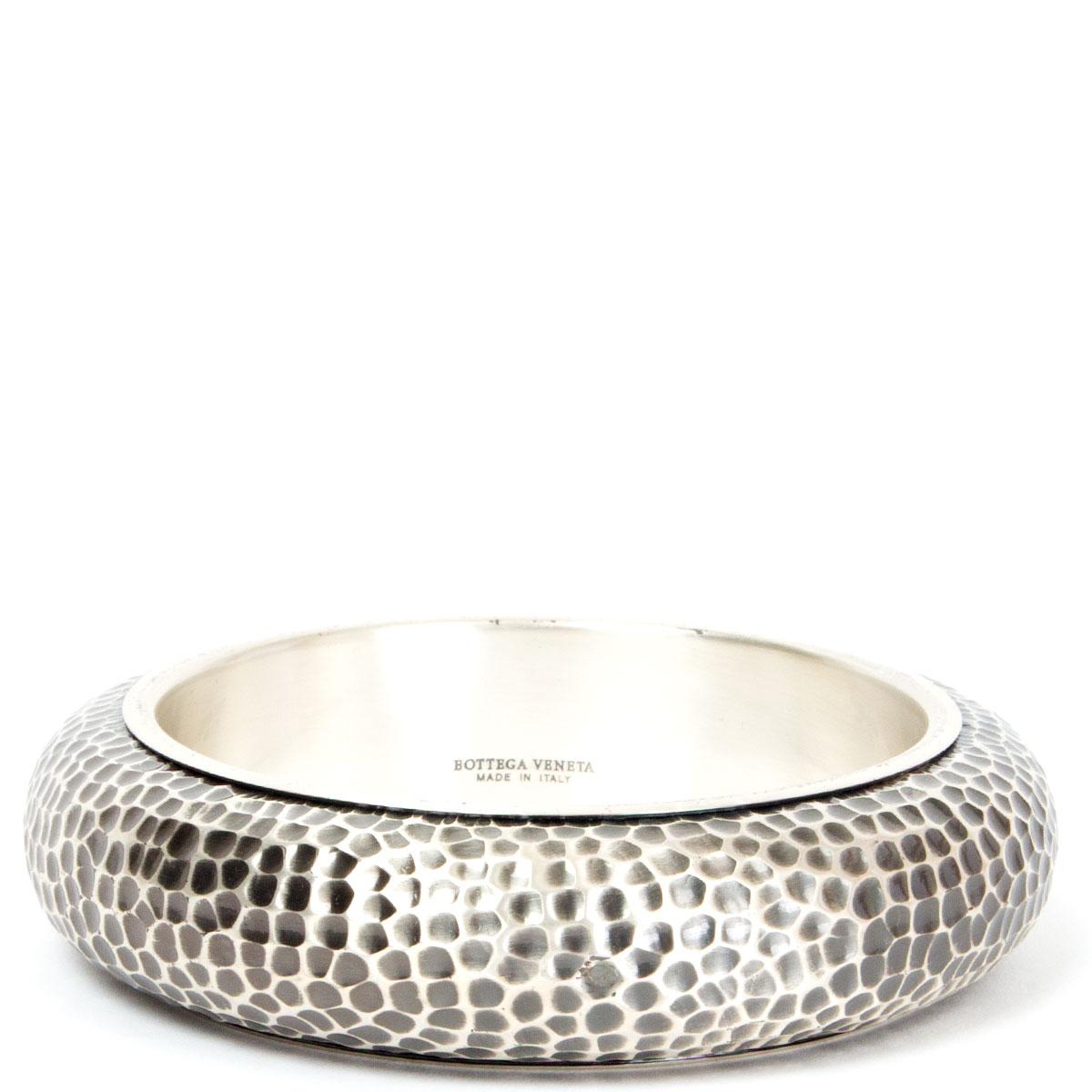 authentic Bottega Veneta oxidized hammered bangle bracelet in sterling silver. Has been worn and are in excellent condition. Comes with box and dust bag. 

Tag Size M
Circumference 20.5cm (8in)

