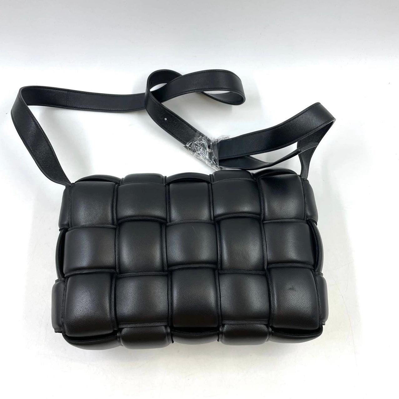 Bottega Veneta Padded Cassette Black Leather
 These are professional photos of the actual bag offered by Luxbags.
 Discover the luxurious craftsmanship of Bottega Veneta with this handwoven black leather Padded Cassette shoulder bag. Boasting an