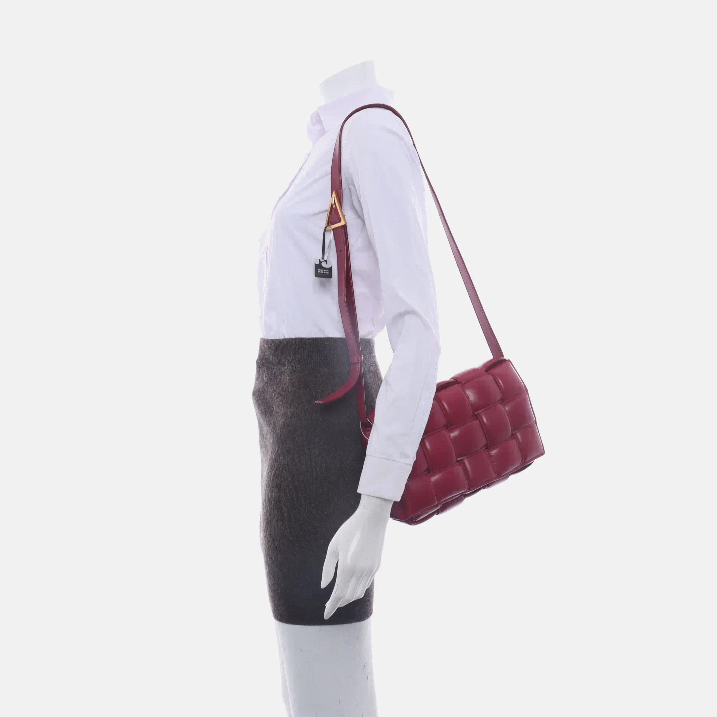 Bottega Veneta Padded Cassette Burgundy Red Leather
  These are professional photos of the actual bag.
  Discover the luxurious craftsmanship of Bottega Veneta with this handwoven black leather Padded Cassette shoulder bag. Boasting an iconic
