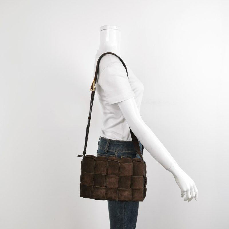 Bottega Veneta Padded Cassette Suede Leather Dark Brown Tan
 These are professional photos of the actual bag offered by Luxbags.
 Discover the luxurious craftsmanship of Bottega Veneta with this handwoven black leather Padded Cassette shoulder bag.