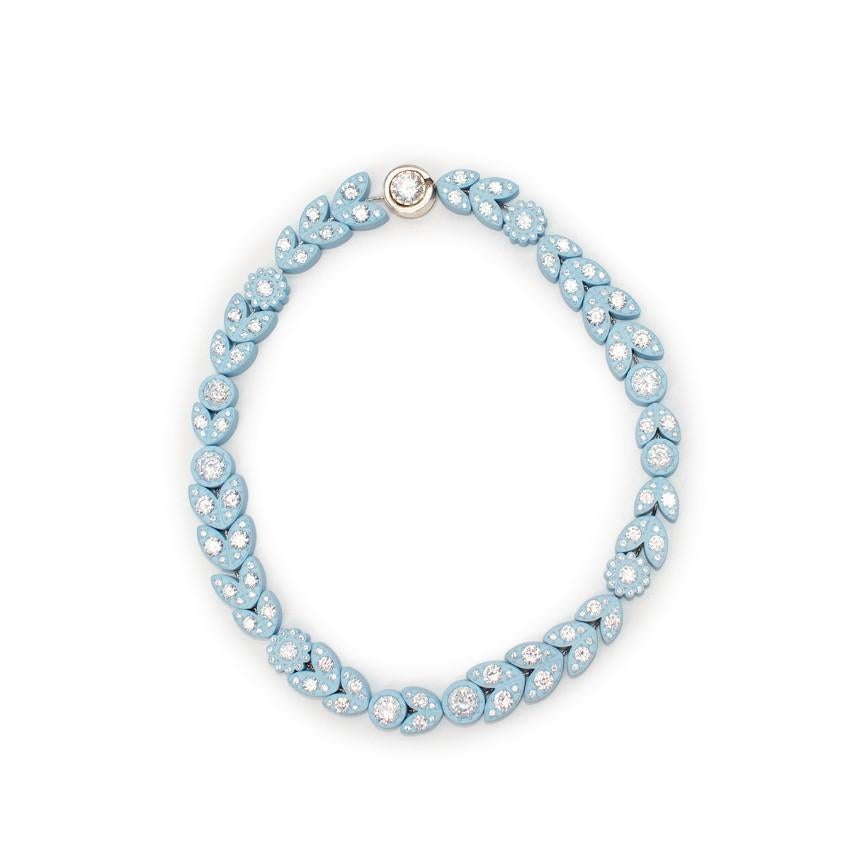 Bottega Veneta Pastel Blue Crystal Embellished Necklace

- Silver and cubic zirconia necklace with a soft touch rubber finish
- Adorned with small cubic zirconia encrusted on top of little floral and petal details
- Magnetic fastening
- Silver-tone